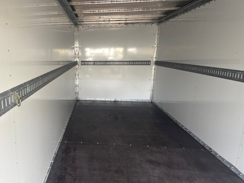 Inside a MI-BOX storage container - clean steel interior with tie-down rails